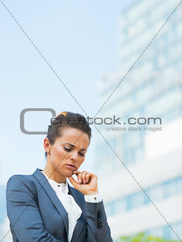 Portrait of stressed business woman in office district