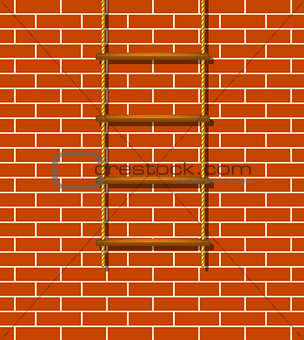 Wooden rope ladder and brick wall