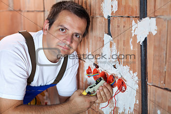 Electrician working in a new building