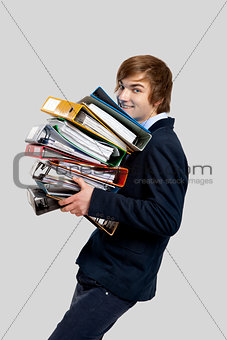 Business man carrying folders