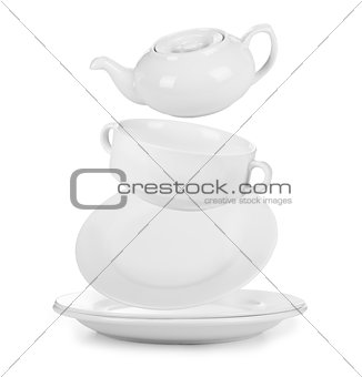 Clean empty plates and cups isolated on white