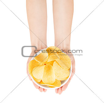 two hands holding a bowl of potato chips