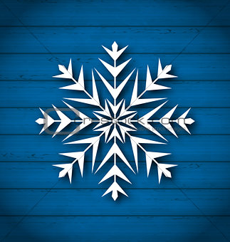 Geometric snowflake on wooden background