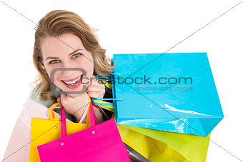 Overhead of a woman holding many shopping bags