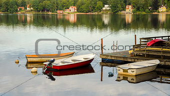 Three boats at wooden pier
