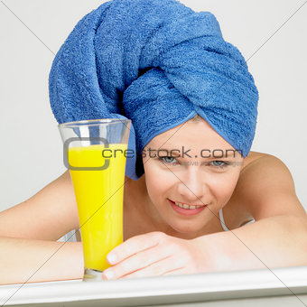 woman with turban and a glass of juice