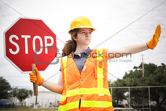 Female Construction Worker Directs Traffic