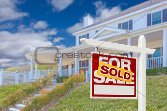 Sold Home For Sale Real Estate Sign and House