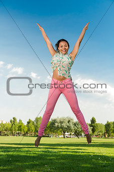Beautiful African American woman jumping