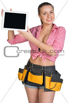 Woman in tool belt showing tablet PC with blank screen