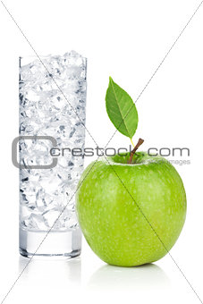 Glass of water with ice and fresh green apple