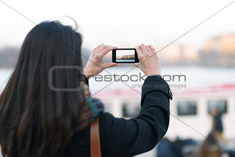 Woman Taking Outdoor View using Mobile Phone