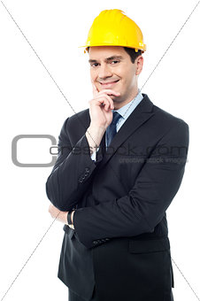 Businessman holds his hand on his chin
