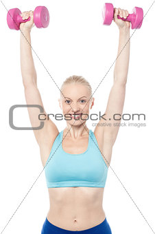 Fitness woman lifting dumbbells