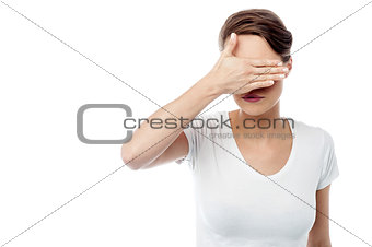 Woman hiding his eyes from light