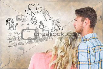 Composite image of attractive young couple looking together