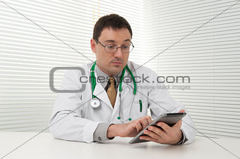 doctor using tablet computer