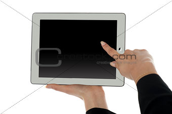 Female finger pointing at blank screen of tablet pc