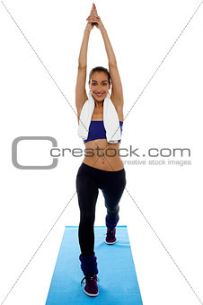 Fit woman doing stretching exercise