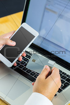 Man using laptop for online shopping
