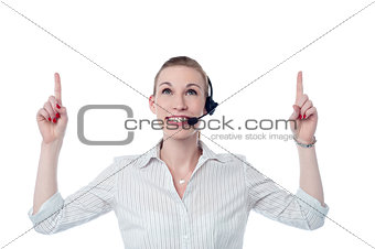Young call center woman pointing up