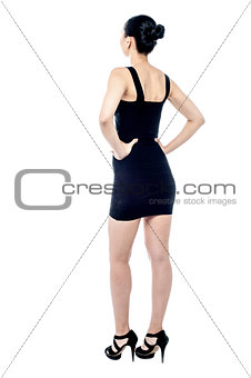 Rear view of woman model, hand on waist