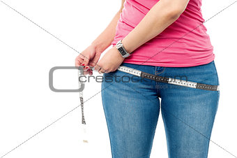 Closeup picture of woman with measure tape