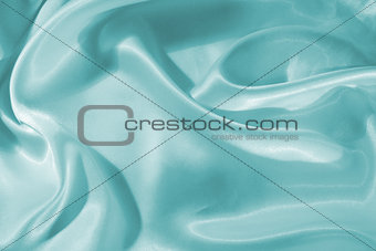 Smooth elegant blue silk or satin as background 