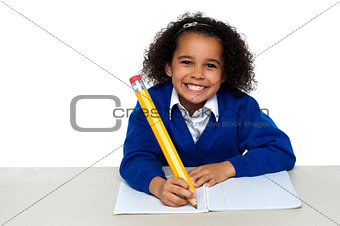 Pretty girl writing in her notebook