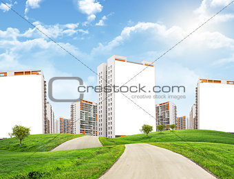 Cityscape under blue sky with road