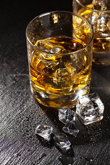 Glasses of whiskey with ice
