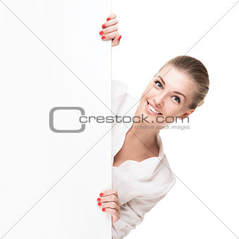 Smiling blond woman holding signboard