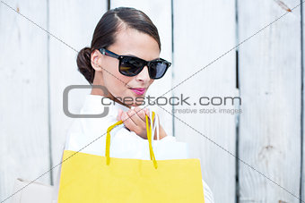 Pretty brunette holding shopping bags