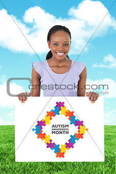 Composite image of woman with placeholder in her hands on white background