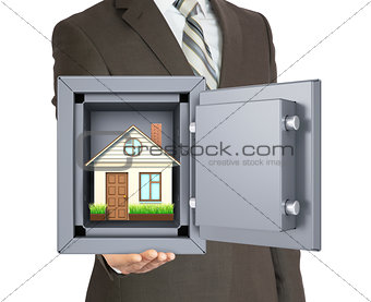 House in safe on mans hand