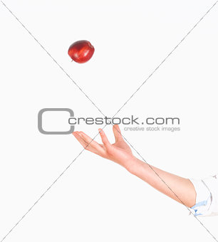 Hand Tossing Red Apple in the Air 