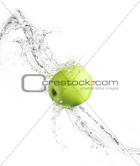 Green apple with water splash, isolated