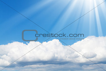Blue sky, sun and clouds with copy space