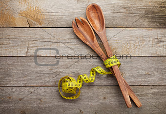 Measure tape with kitchen utensils. Diet food