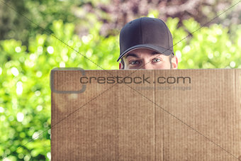 Man delivering a large cardboard box