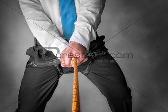 businessman on climbing rope