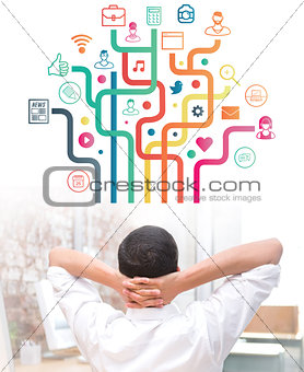 Composite image of businessman with hands behind head at desk