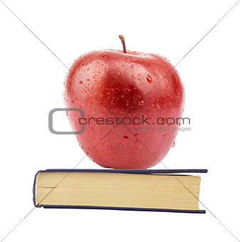Fresh apple on book