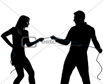 one couple man and woman pulling a rope silhouette
