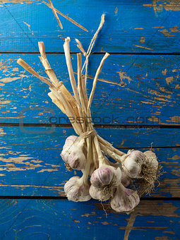 Garlic on blue wooden table 