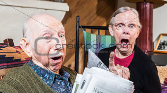 Angry Old Couple with Newspaper