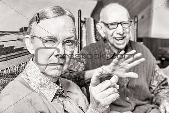 Toned Image of Angry Old Couple in Livingroom