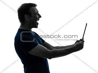 man holding digital tablet  laughing portrait  silhouette