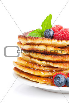 Pancakes with raspberry, blueberry, mint and honey syrup