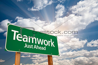 Teamwork Green Road Sign Over Clouds